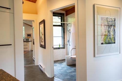 a bathroom with a shower and a toilet and a sink at Moon Dance Perch in Madeira Park