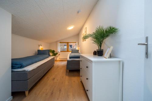 a living room with a bed and a couch at Large apt in town center next to Brunngasse & near lake in Brienz