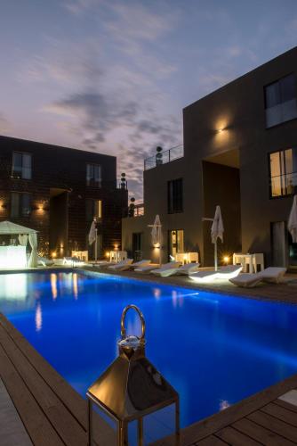 a large swimming pool in a building with a lit upledgedledgedledgedledgedledged at Nacala Plaza Business Design Hotel in Cidade de Nacala