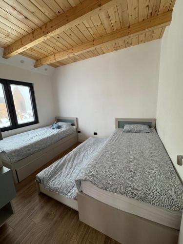 Postel nebo postele na pokoji v ubytování Vamas Villa