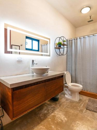 a bathroom with a sink and a toilet at Sarab Hotel in Ensenada