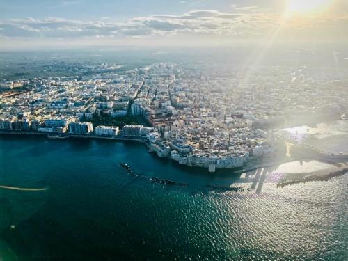 an aerial view of a city next to the water at B&B re apartments Palazzo Muscati in Molfetta