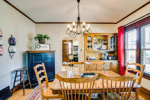 a dining room with a wooden table and chairs at Charming Winterset Vacation Rental with Yard and Patio in Winterset