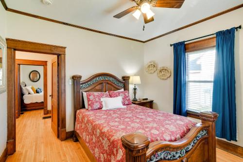 a bedroom with a bed and a ceiling fan at Charming Winterset Vacation Rental with Yard and Patio in Winterset