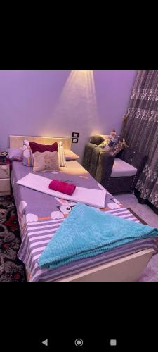 a bedroom with two beds with pillows on them at Happy house Aswan in Aswan