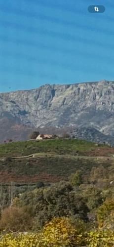 a view of a hill with a mountain in the background at El LABRAO DE ALARDOS in El Raso