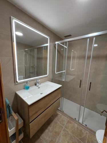 a bathroom with a sink and a shower at La Garita Vista azul in La Garita