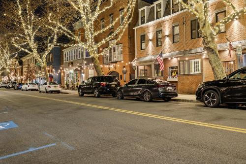 a street with cars parked on the side of the road at Piermont Waterfront Villa with Hot Tub in Piermont