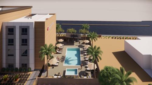 an artist rendering of a proposed hotel with a swimming pool at Candlewood Suites Mesa - Phoenix East by IHG in Mesa