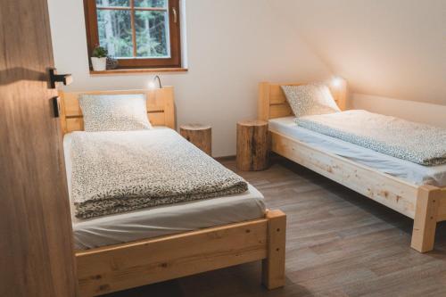 Postel nebo postele na pokoji v ubytování Wellness Chalupa Krajanka