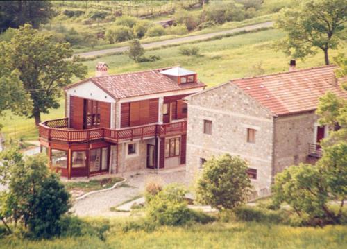 a large house in the middle of a field at Azienda Agricola Il Querceto in Marsico Vetere