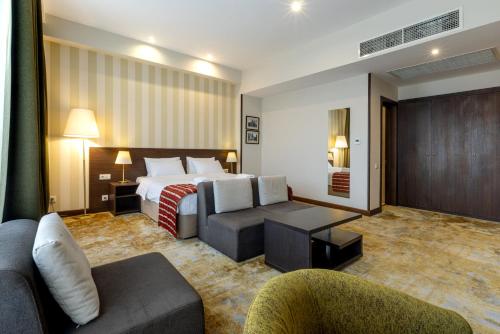 Postel nebo postele na pokoji v ubytování Citrus Hotel