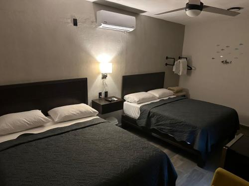 Postel nebo postele na pokoji v ubytování FIESTA MIRAMAR