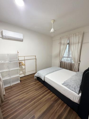 a bedroom with a bed and a window at TuR15 SPlCE 10pax 4room Private House in Bayan Lepas