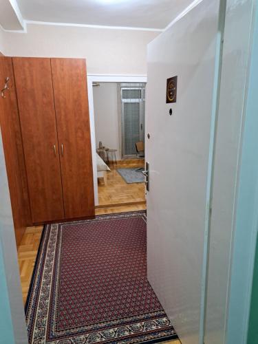 an open door to a room with a hallway at Apartman Dream M Zaječar in Zaječar