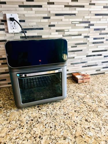 a microwave oven sitting on top of a counter at 41 Montrose Master Bedroom in Newark
