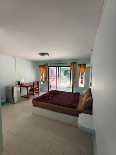 a bedroom with a large bed in a room at Nicha Resort Koh Phangan in Thong Sala