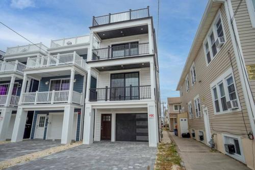 an apartment building with balconies on the side of it at Unlimited Ocean Views 5 BR 5 Bath Beach Block in Seaside Heights