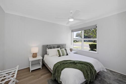 Ένα ή περισσότερα κρεβάτια σε δωμάτιο στο Frangipani Hideaway
