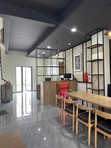 a dining room with a table and some chairs at The Vista Châu Đốc Hotel in Chau Doc
