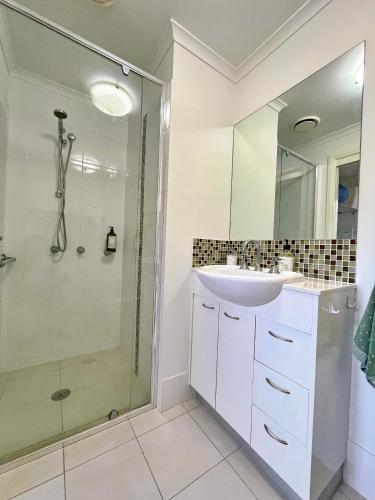 a bathroom with a sink and a shower at Capeview 12 in South West Rocks
