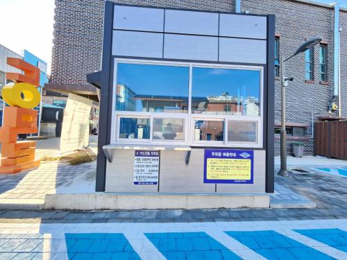 a building with a sign on the side of it at Picturesque Serenity Art-In in Jeonju