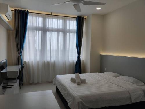 Ένα ή περισσότερα κρεβάτια σε δωμάτιο στο Urban Riverview Couple Suite - Riverine Kuching