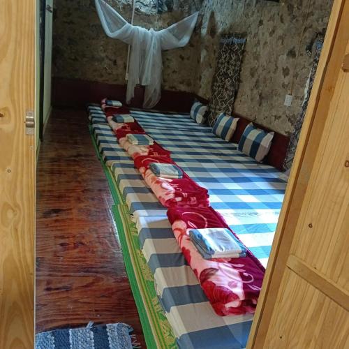 Ένα ή περισσότερα κρεβάτια σε δωμάτιο στο Quang Thuận Bản Giốc Homestay