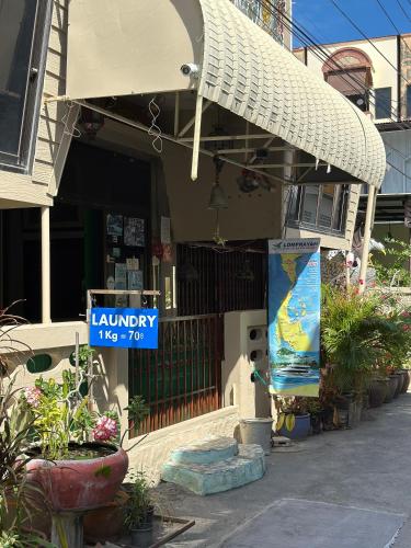 a library has a sign in front of a building at King's Home Hua Hin Homestay in Hua Hin