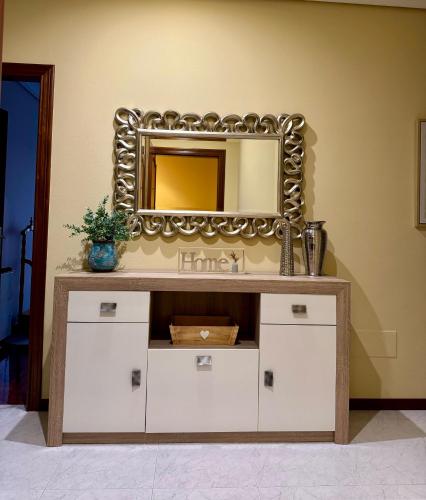 a mirror on top of a dresser in a room at Rincon Azul in Arcade