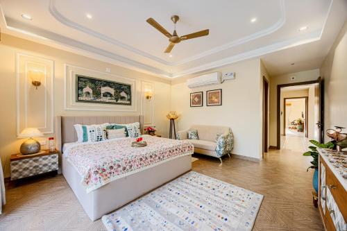 a bedroom with a bed and a ceiling fan at ELIVAAS Heaven in Hills Mountara 3 BHK Villa with Lounge & Pvt Pool in Udaipur