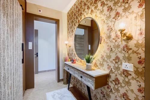 a bathroom with a sink and a mirror at ELIVAAS Heaven in Hills Mountara 3 BHK Villa with Lounge & Pvt Pool in Udaipur