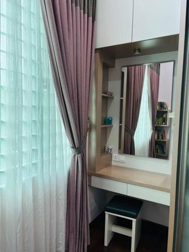 a dressing room with a mirror and a curtain at Kuantan Bungalow PS4 16 Pax Kids Pool in Kuantan