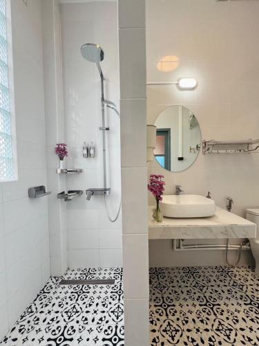 a bathroom with a tub and a sink and a mirror at Garden House Rice Field and Mountain View in Luang Prabang