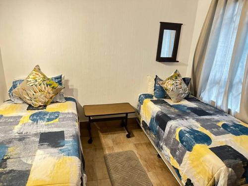 En eller flere senge i et værelse på Beachfront home