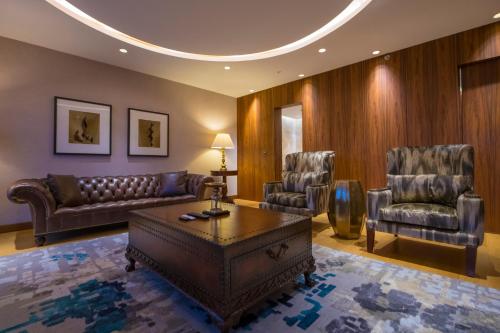 a living room with a couch and two chairs at Crowne Plaza Kayseri by IHG in Kayseri