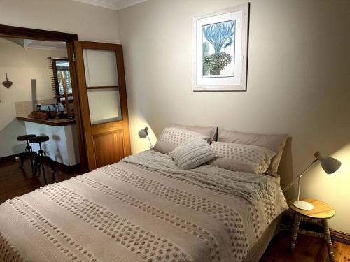 a bedroom with a large white bed in it at Guwarri Bayside Retreat in Broome