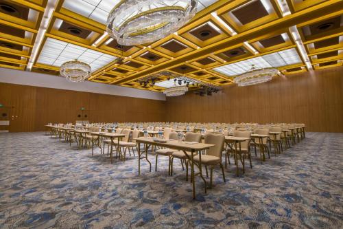 a large room with tables and chairs in it at Crowne Plaza Kayseri by IHG in Kayseri