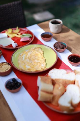 a table topped with plates of food on a table at Ayaz Stone House in Goreme