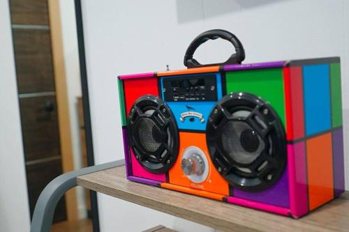 a colorful radio sitting on top of a table at Beautiful Renovated Cozy Forest Home with Hot Tub in Crestline in Crestline