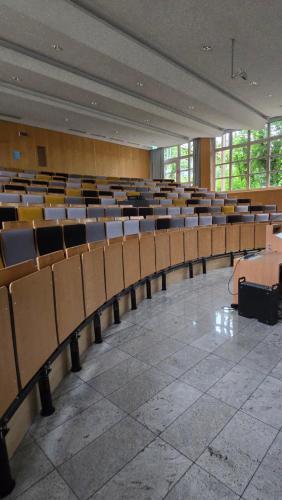 an empty auditorium with rows of chairs in a building at Sportschule Oberhaching in Oberhaching