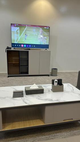 Televisyen dan/atau pusat hiburan di فندق قمم بارك Qimam Park Hotel 7