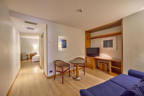 a living room with a couch and a table in a room at Civis Jaime I in Castellón de la Plana