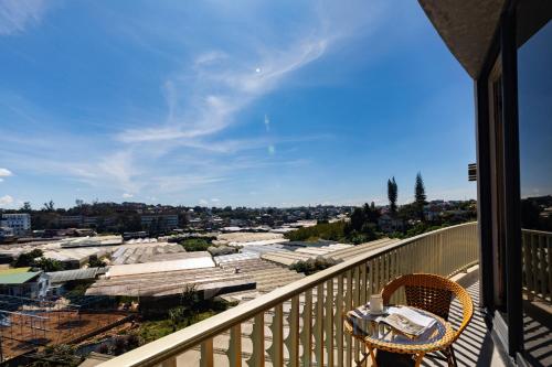 a balcony with a table and a view of a city at Phuc Hai Hotel Da Lat in Da Lat