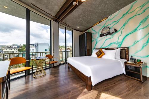 Postel nebo postele na pokoji v ubytování Phuc Hai Hotel Da Lat