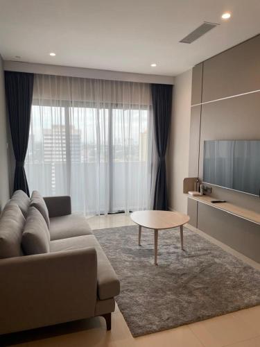 a living room with a couch and a table at Suasana Suites Johor Bahru City Centre in Johor Bahru
