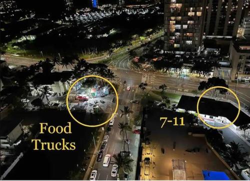 an overhead view of a city street at night at A Cozy Studio at Waikiki in Honolulu