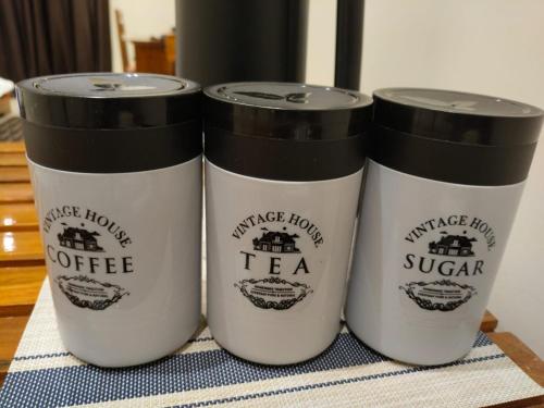 three coffee cups sitting on top of a table at Shantadurga Beachside Homestay in Guhagar