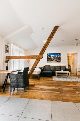 a living room with a couch and a table at Statek Samsara in Blansko