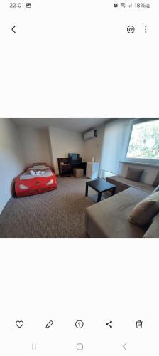 a room with a red suitcase sitting on the floor at Guesthouse Hill in Sarajevo